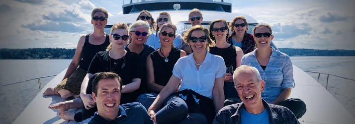 Optometrist Bainbridge Island WA Davis Kirscher Scott Brase Gavin Hollyer Team Doctors Davis Kirscher Scott Brase Gavin Hollyer with their team on a boat off the coast of Bainbridge Island WA